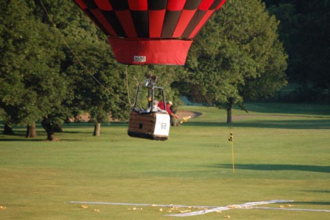 Hot Air Balloon Pilot tossing marker at target